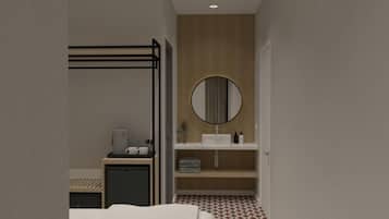 Un baño moderno con inodoro empotrado, lavamanos, espejo y barra para toallas.