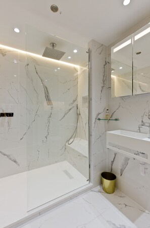 Shower, hair dryer, towels, soap