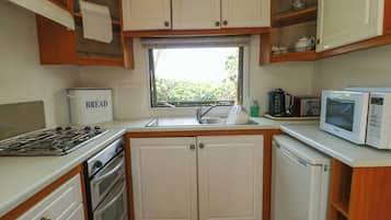 Fridge, electric kettle, toaster, cookware/dishes/utensils