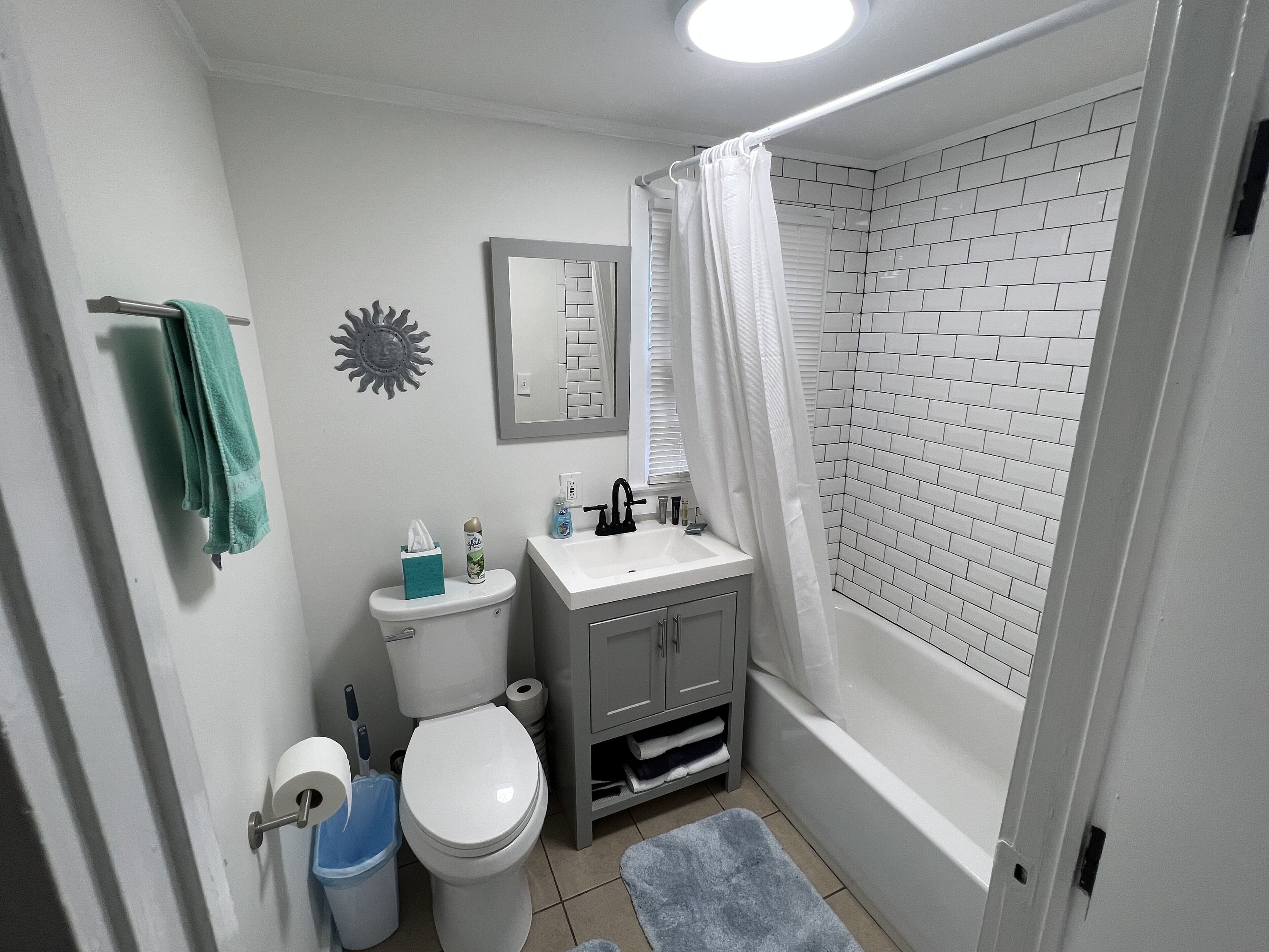 Combined shower/tub, hair dryer, towels, soap