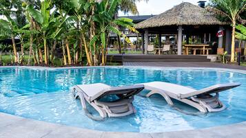 Outdoor pool, pool umbrellas, sun loungers