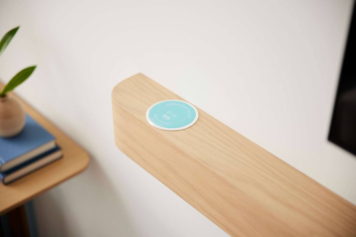 A wooden table with a blue circular object on it.