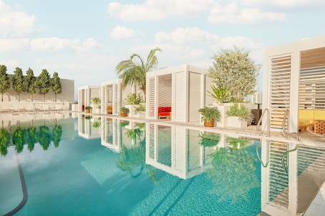 Outdoor pool, open 7:00 AM to 8:00 PM, cabanas (surcharge)