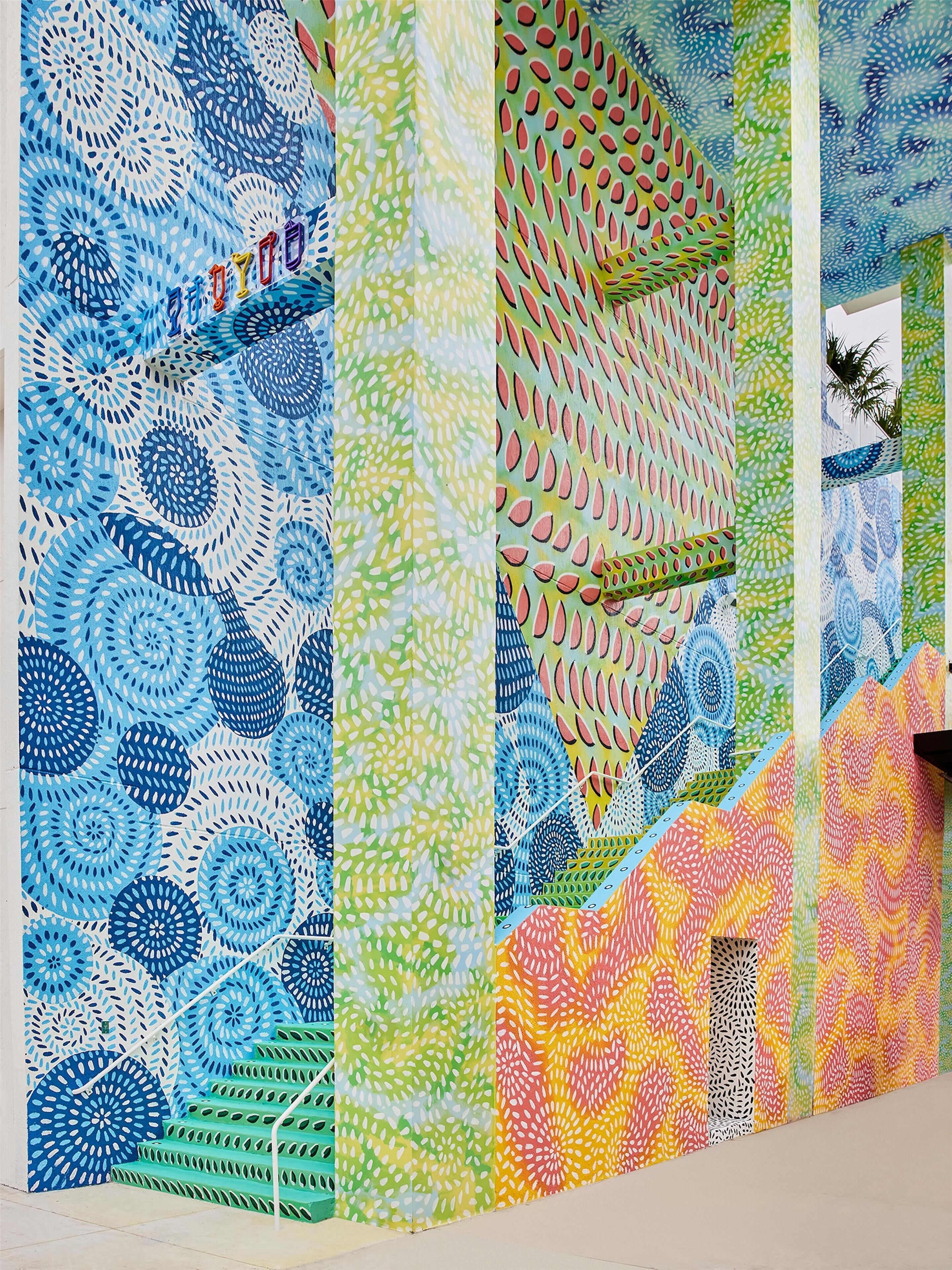 A wall with a variety of geometric patterns and designs.