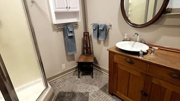 Shower, hair dryer, towels, soap