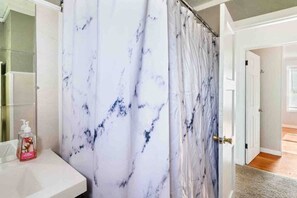 Combined shower/tub, hair dryer