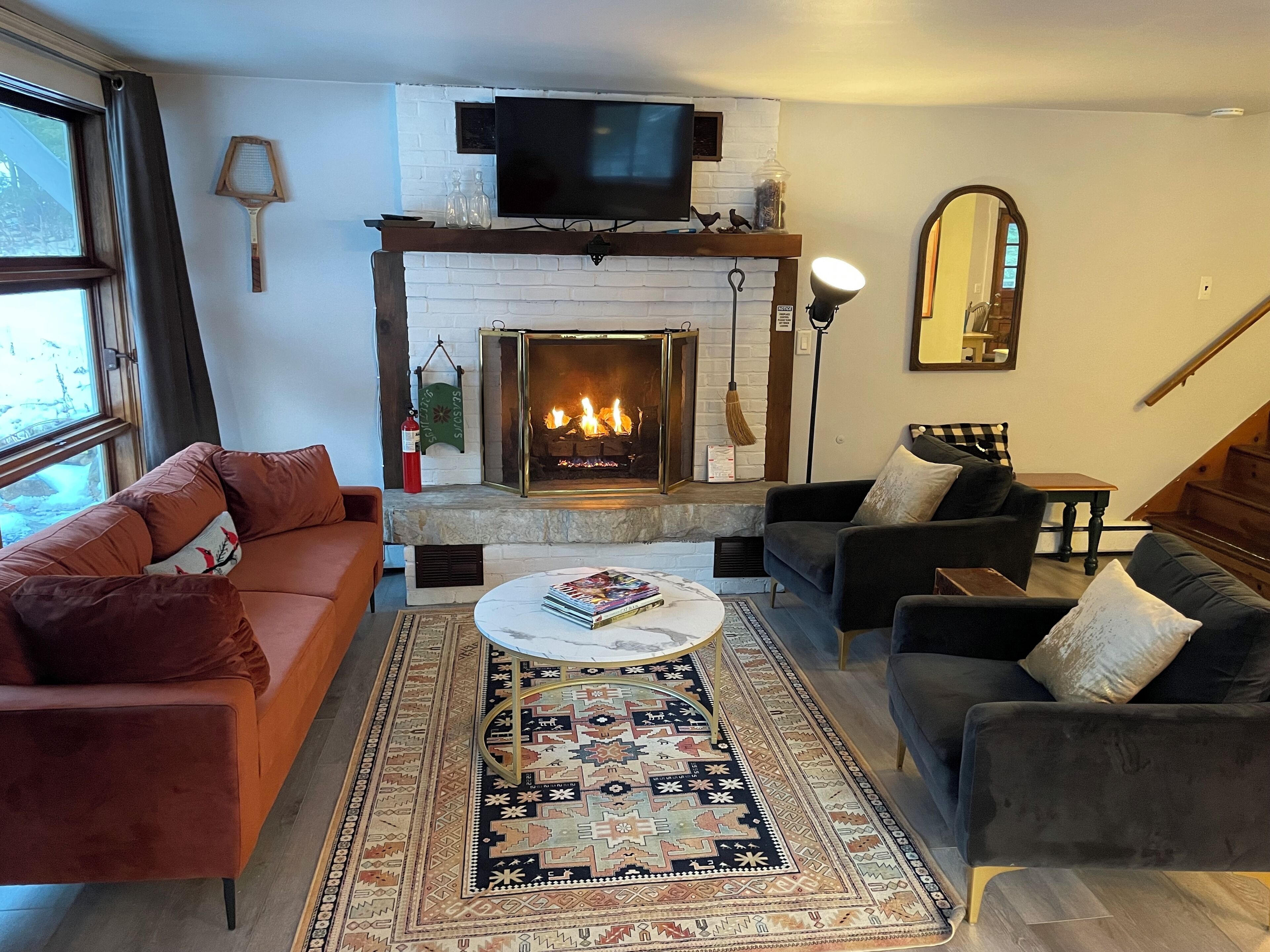 Smart TV, fireplace, foosball, books