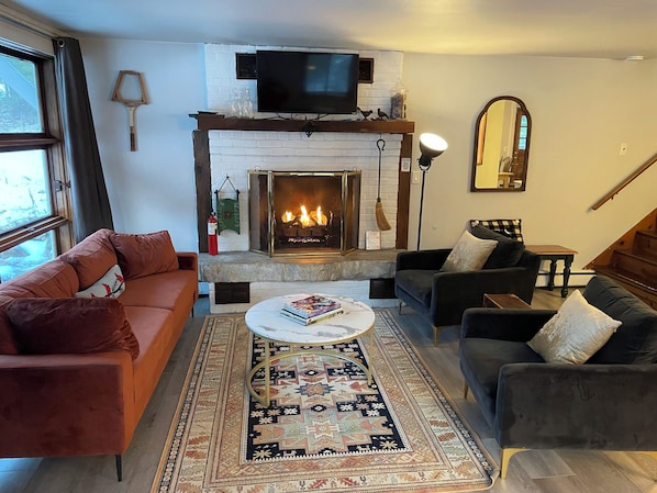 Smart TV, fireplace, table football, books