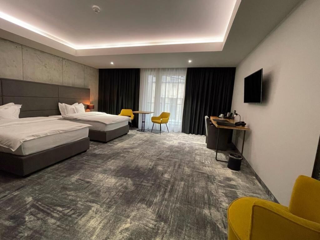 Premium bedding, down comforters, pillowtop beds, minibar