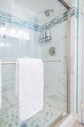 Shower, hair dryer, towels, soap