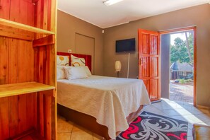 Enjoy a comfortable stay in this well-appointed room featuring a bed, wardrobe, and TV.