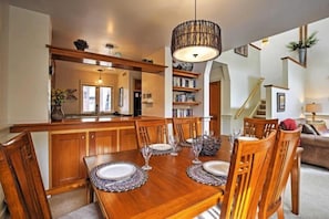 Enjoy meals in this well-appointed dining area with a table for four and comfortable seating.
