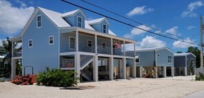 Enjoy stunning ocean views from the upper balcony or relax on the covered porch.