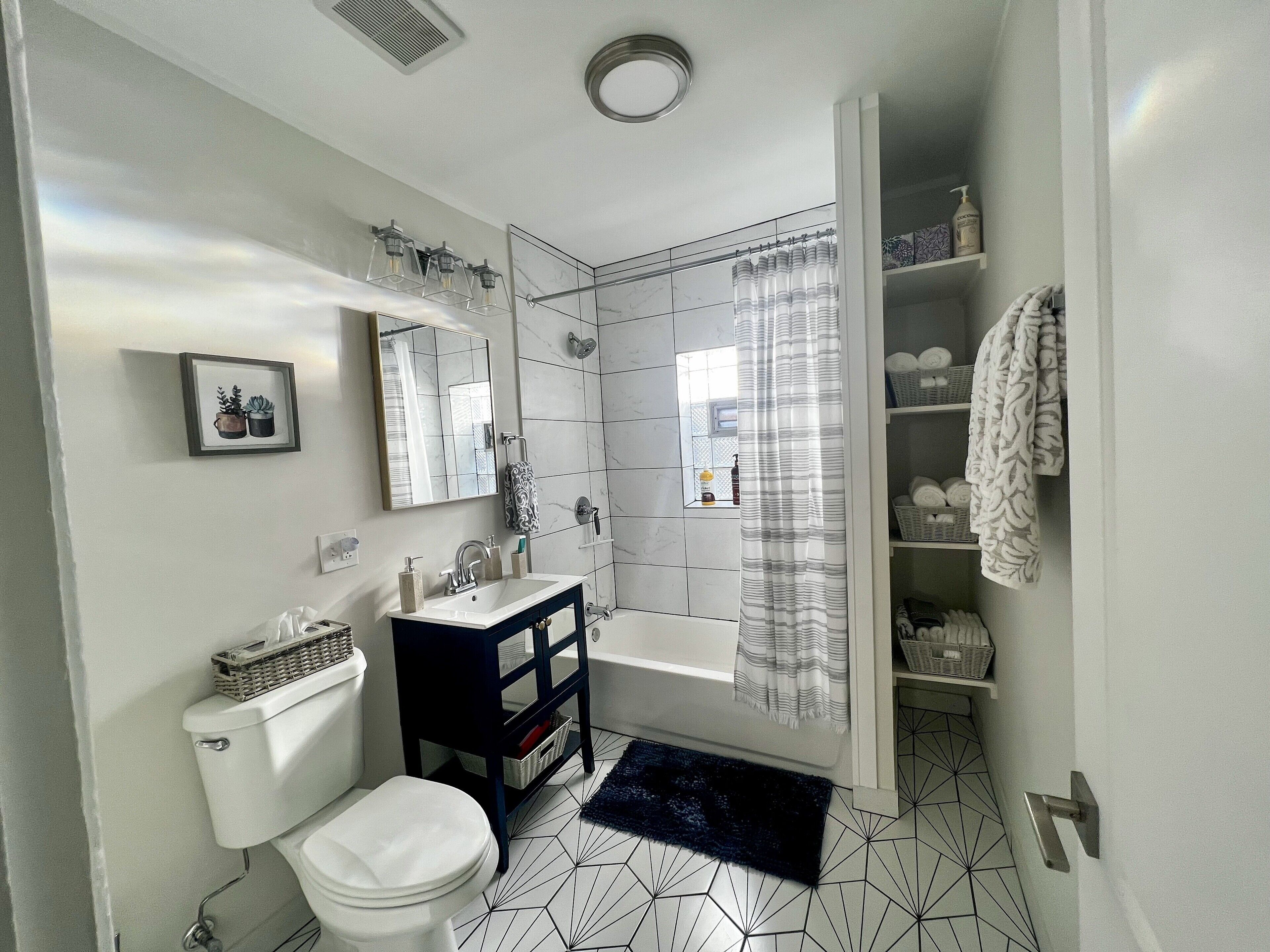 Combined shower/tub, hair dryer, towels, soap