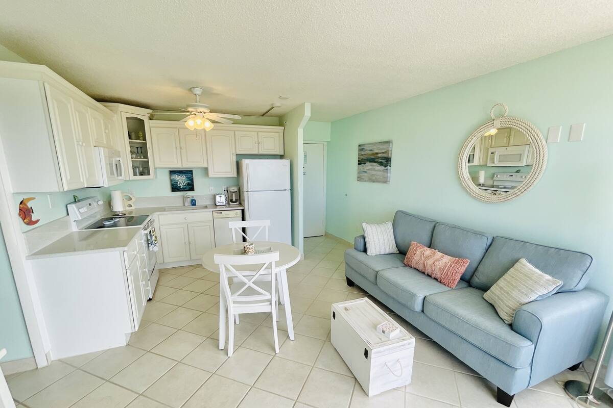 Premier Condo, 1 King Bed with Sofa bed | Living area | 38-inch flat-screen TV with cable channels, TV