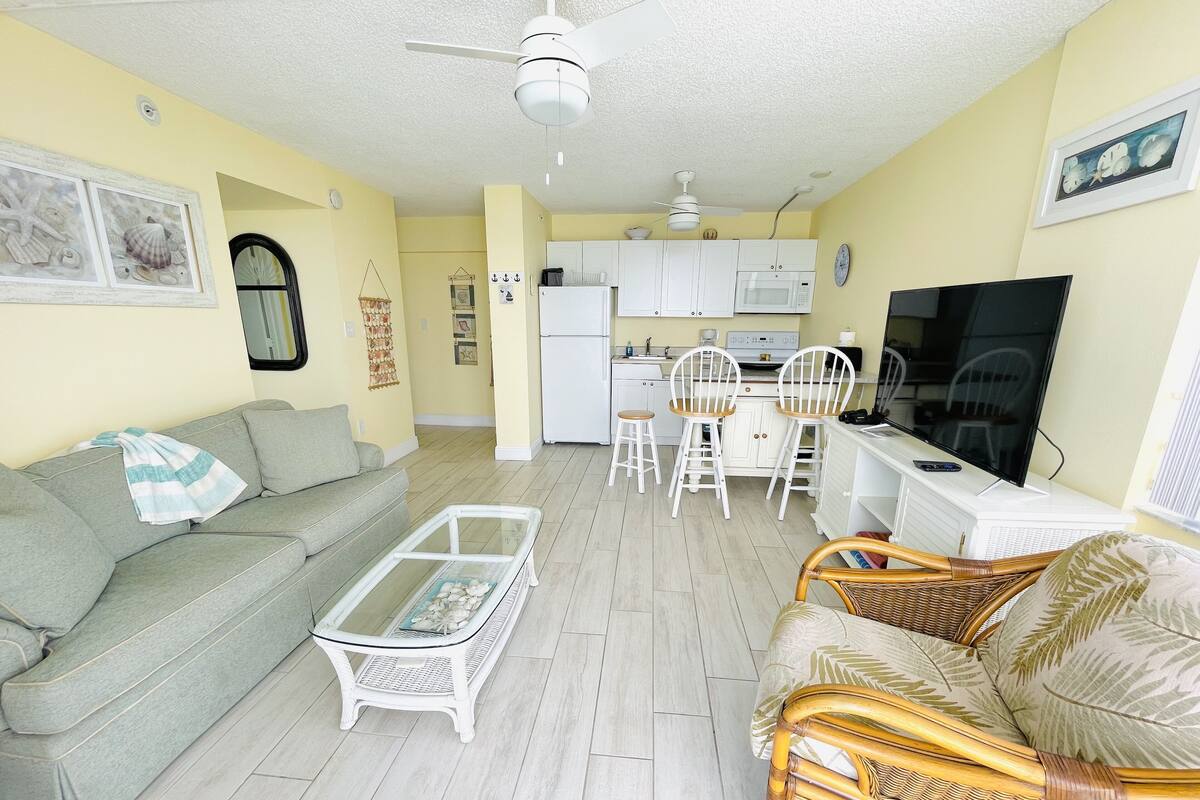 Premier Condo, 1 King Bed with Sofa bed | Living area | 38-inch flat-screen TV with cable channels, TV