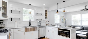 Stylish 4 bedroom house with outdoor dining and fenced backyard.