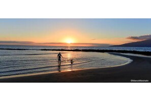 On the beach, sun loungers, beach towels