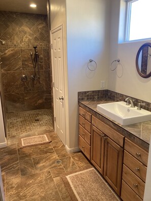 Combined shower/tub, hair dryer, towels, soap