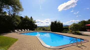 Seasonal outdoor pool, open 9:00 AM to 9:00 PM, pool umbrellas