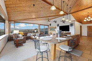 Olympic Suite | Living area | 55-inch TV with cable channels