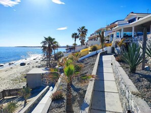 On the beach, sun loungers, beach towels