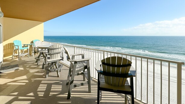 A balcony with outdoor furniture overlooking the ocean. - Crystal Shores West 403 - BEACH FRONT | Zero Entry Pool, Indoor Pool, Hot Tub, Sauna, Fitness (Gulf Shores)