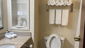 A bathroom with a sink, toilet, and towel rack. - White Pine Lodge (Salamanca)