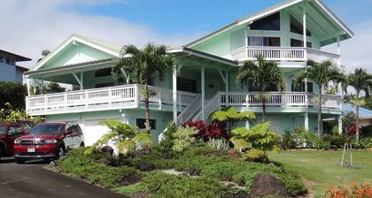 A house in a quiet residential area on a hill overlooking Hilo Bay.