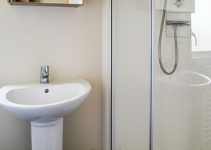 Unclassified image, 2 of 7, button - Comfortable modern 12ft-wide caravan with one double and two twin. (Mablethorpe)