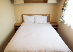 Unclassified image, 5 of 7, button - Comfortable modern 12ft-wide caravan with one double and two twin. (Mablethorpe)