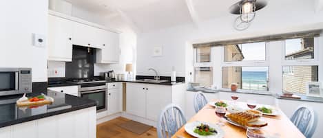 Fridge, microwave, oven, cookware/dishes/utensils