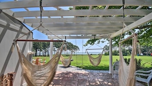 A covered outdoor area with hammocks and a patio. - Spacious Cheriton Home: 8 Mi to Cape Charles! (Cheriton)