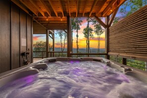 A hot tub with a view of a sunset and trees. - Daybreak Ridge - Blue Ridge, GA. (Blue Ridge)