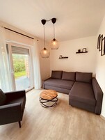 Comfort Townhome | Living area | 40-inch flat-screen TV with satellite channels, TV