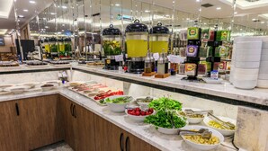 A buffet area with various food items and drink dispensers. - Hamitbey Hotel (Istanbul)