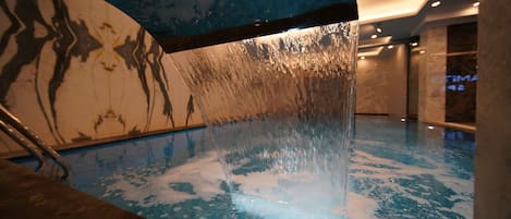 Indoor pool, open noon to 10:00 PM, pool loungers