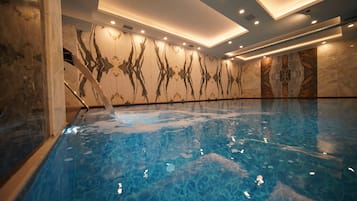 Indoor pool, open noon to 10:00 PM, pool loungers