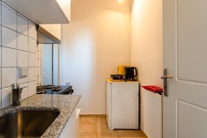 Fridge, microwave, coffee/tea maker, toaster