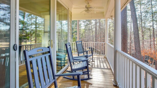 A wooden deck with a glass door leading to a covered porch. - Lakefront McCormick Gem: Deck & Golf Course Views (McCormick)