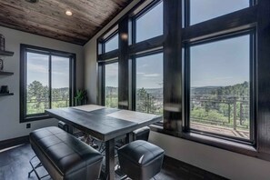 Enjoy expansive views of the surrounding landscape from the large dining table.