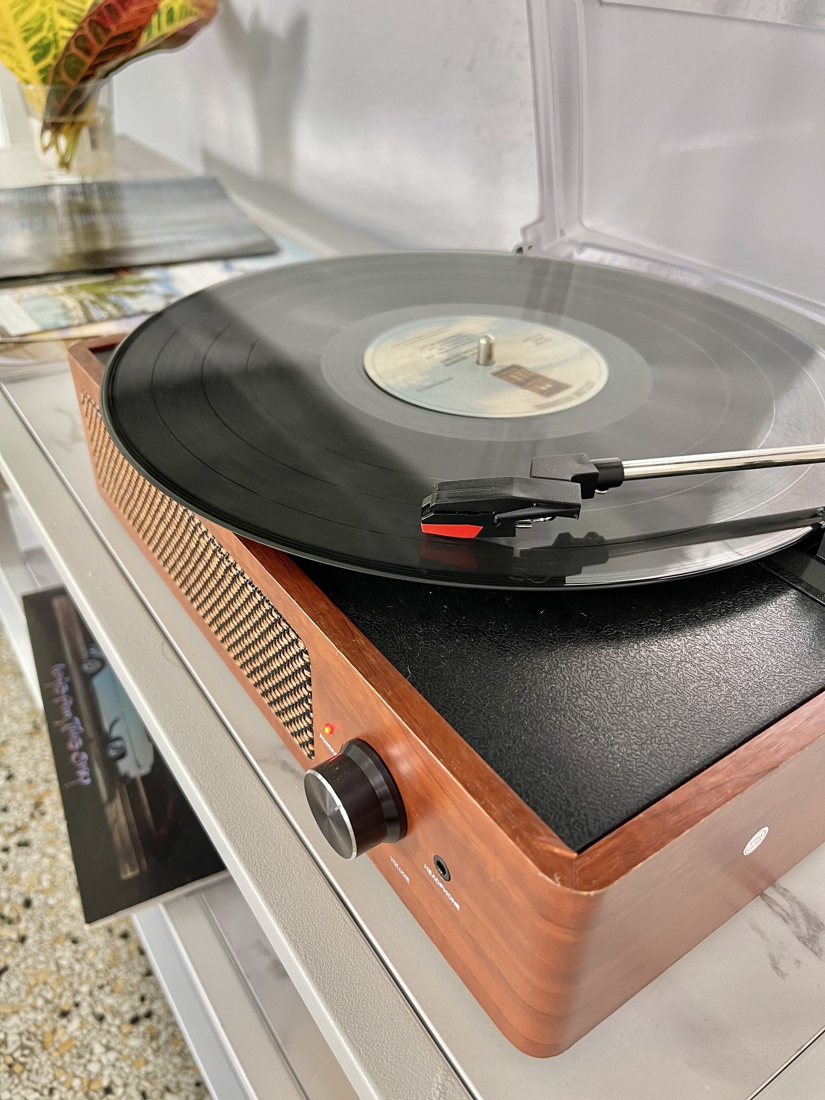 A turntable with a vinyl record on it.