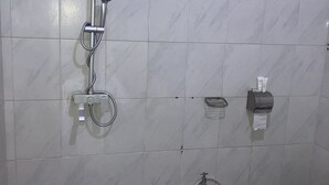A bathroom with a shower, toilet, and sink. - Marthie Homeaway (Dodoma)