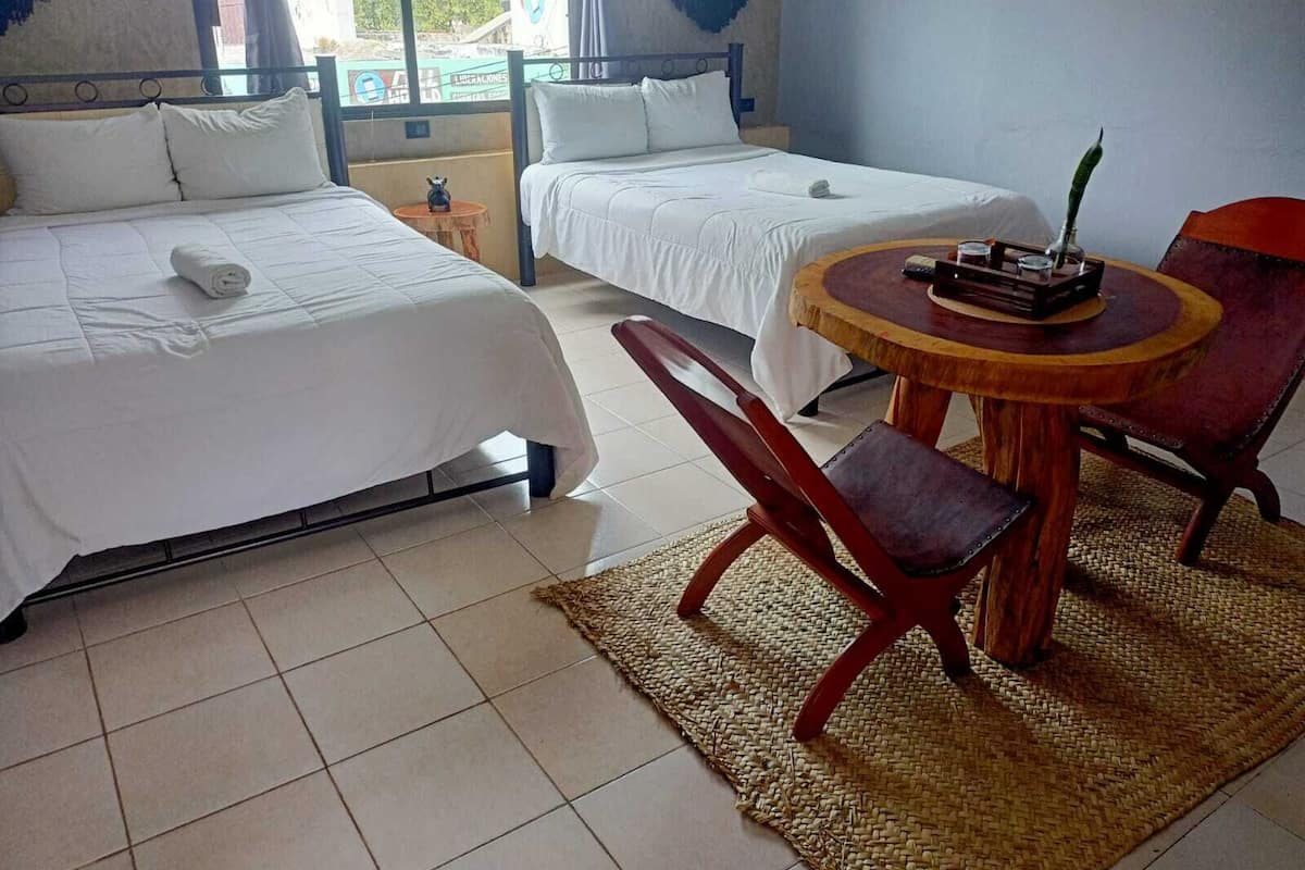 Deluxe Quadruple Room | Premium bedding, laptop workspace, blackout drapes, iron/ironing board