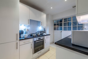 Premium Apartment | Private kitchen | Electric kettle, toaster, dining tables - Pelham Court Apartments (London)