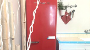 A red vintage refrigerator in a kitchen with a white cabinet and a blue countertop. - Harry's Man Cave: The New Star Motel Experience (Moreno Valley)