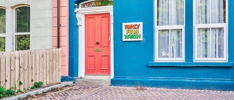 A building with a red door and a sign reading "Forty Four North."