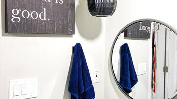 Shower, hair dryer, towels, soap