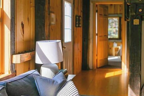 View of the hall going to the main bedroom and back door.