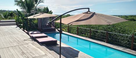 Outdoor pool, open 6:00 AM to 10:00 PM, pool umbrellas, sun loungers